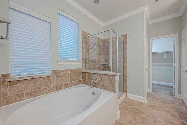 full bath featuring a shower stall, a spacious closet, a garden tub, and ornamental molding