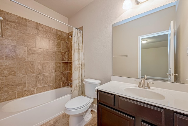 bathroom with tile patterned floors, shower / bath combo with shower curtain, toilet, and vanity