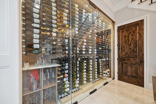 wine cellar featuring ornamental molding