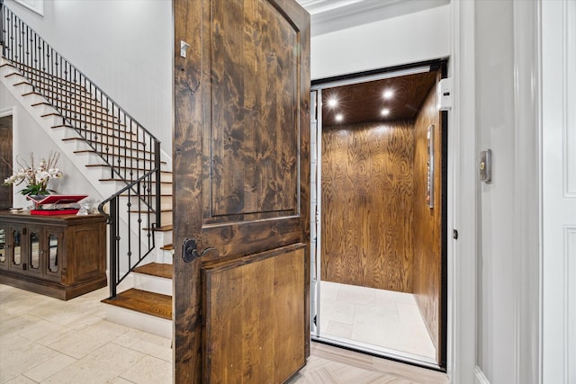 interior space featuring elevator and stairway