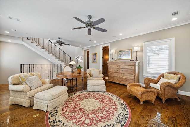 living area with stairway, wood finished floors, visible vents, recessed lighting, and ornamental molding