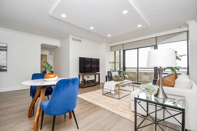 living area featuring recessed lighting, visible vents, and light wood-style flooring