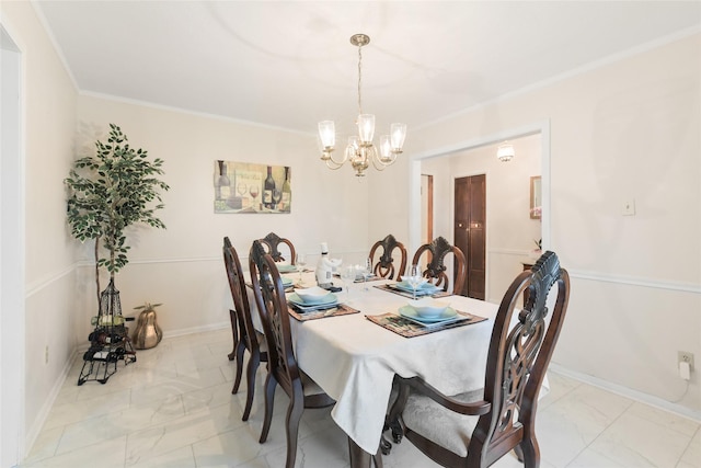 dining room featuring a notable chandelier, baseboards, marble finish floor, and ornamental molding