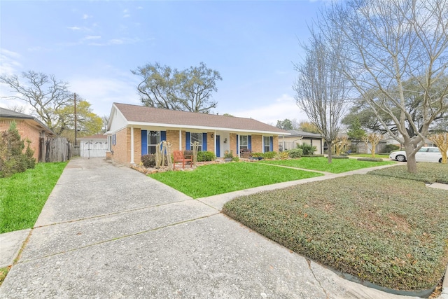 ranch-style house featuring a porch, fence, brick siding, and a front lawn