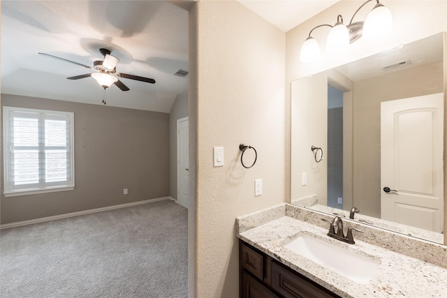 bathroom featuring vanity, baseboards, visible vents, and ceiling fan