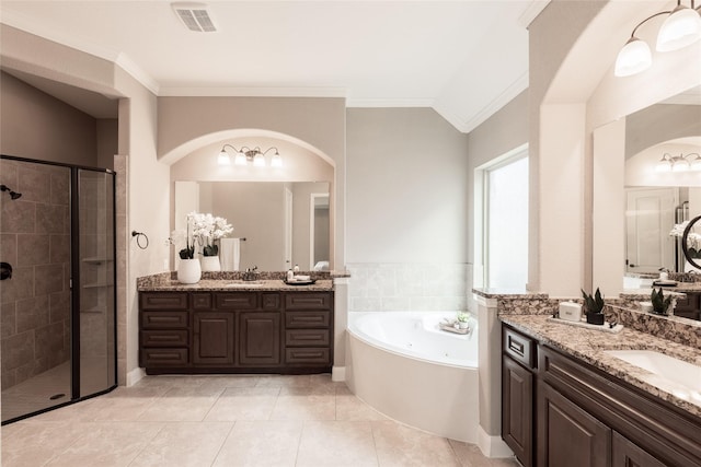 full bath with a stall shower, ornamental molding, visible vents, and a sink