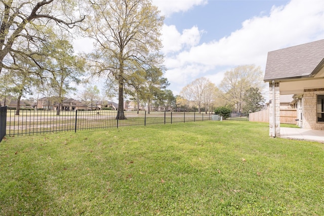 view of yard featuring a patio area and fence