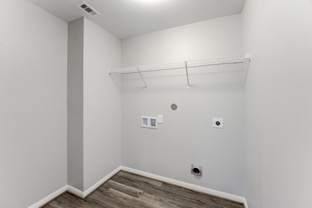 laundry area featuring visible vents, dark wood finished floors, laundry area, electric dryer hookup, and washer hookup