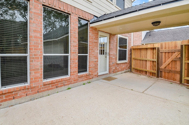 view of patio / terrace with a gate and fence