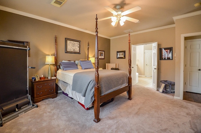 bedroom featuring a ceiling fan, baseboards, visible vents, light carpet, and crown molding