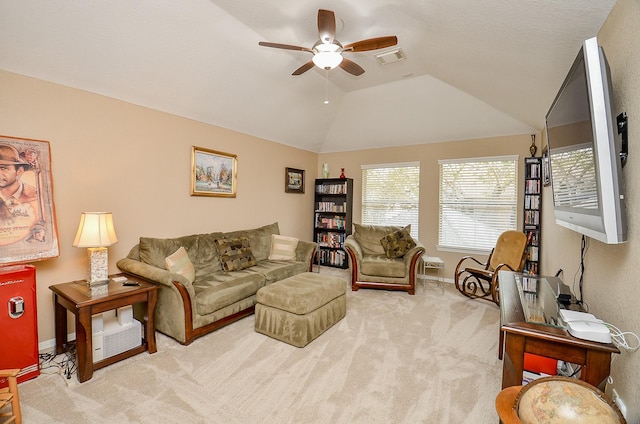 living room with a ceiling fan, baseboards, visible vents, vaulted ceiling, and carpet flooring