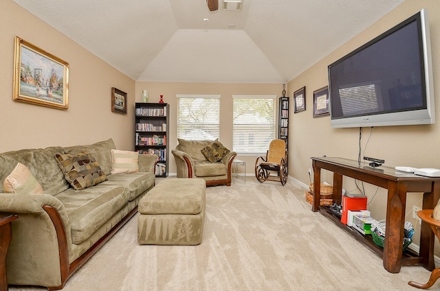 carpeted living area featuring a ceiling fan, baseboards, visible vents, and lofted ceiling