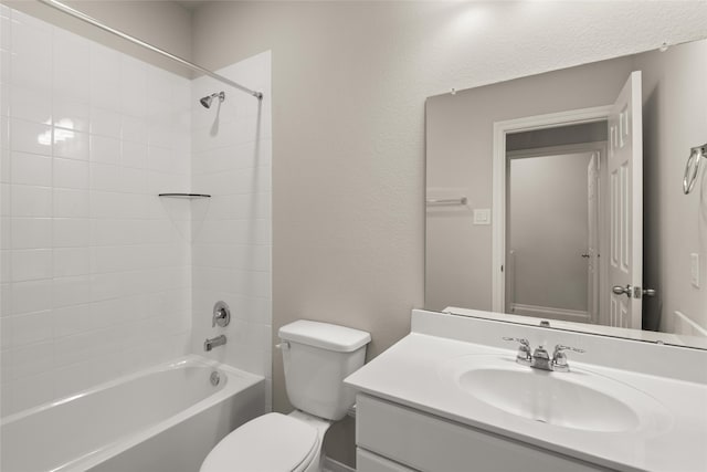 bathroom featuring vanity, toilet, and shower / bathtub combination