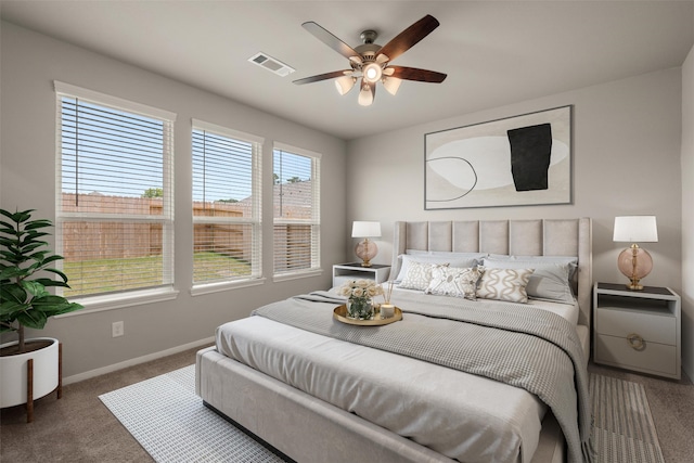 19127 Hazel Firs Ln, Magnolia, TX 77355 - bedroom with carpet floors, baseboards, and a ceiling fan