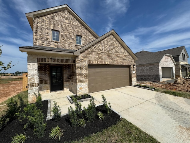 19127 Hazel Firs Ln, Magnolia, TX 77355 - view of front of house with brick siding, concrete driveway, an attached garage, and stone siding