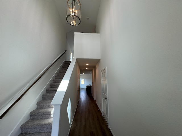 19127 Hazel Firs Ln, Magnolia, TX 77355 - stairway featuring a towering ceiling, wood finished floors, and a chandelier