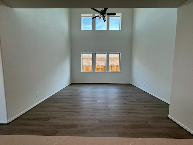 19127 Hazel Firs Ln, Magnolia, TX 77355 - empty room with a ceiling fan, dark wood-style flooring, and baseboards