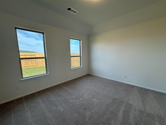 19127 Hazel Firs Ln, Magnolia, TX 77355 - carpeted empty room featuring baseboards and lofted ceiling