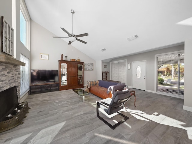 living room with visible vents, high vaulted ceiling, and a healthy amount of sunlight