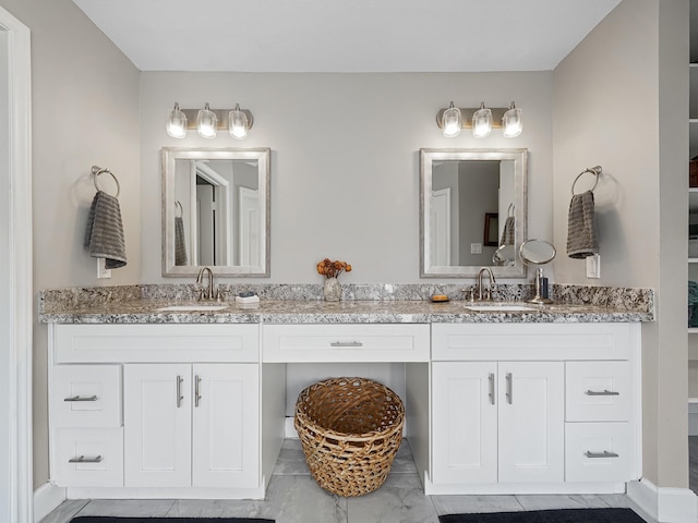 full bath featuring a sink and double vanity