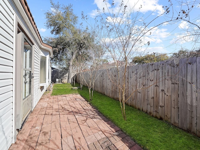 view of patio / terrace with central AC unit and a fenced backyard