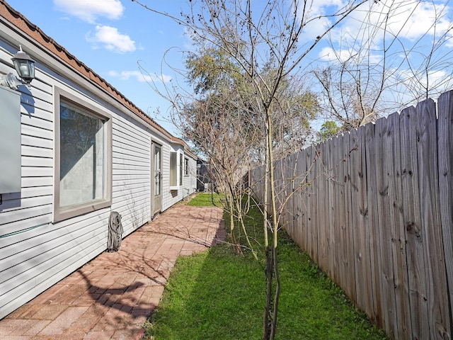 view of yard with a patio and a fenced backyard