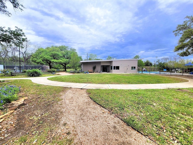 1011 Arrow Hill Rd, Houston, TX 77077 - back of property with a lawn, fence, and a fenced in pool