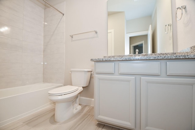 full bathroom with baseboards, toilet,  shower combination, and vanity