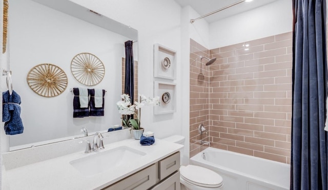 bathroom with vanity, shower / bath combination with curtain, toilet, and visible vents