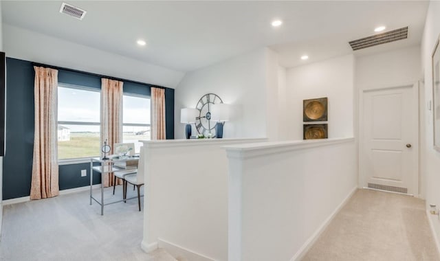 interior space featuring baseboards, recessed lighting, visible vents, and light carpet