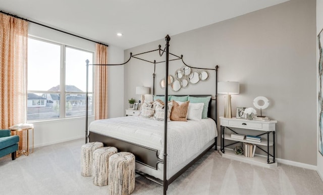 carpeted bedroom featuring recessed lighting and baseboards