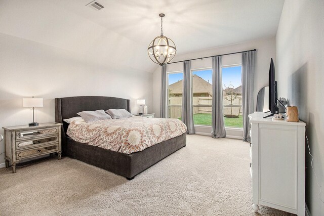 bedroom with visible vents, light colored carpet, a chandelier, and vaulted ceiling