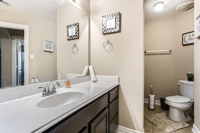 2730 Diamond Vista Ln, Rosharon, TX 77583 - bathroom featuring toilet, vanity, baseboards, and tile patterned flooring