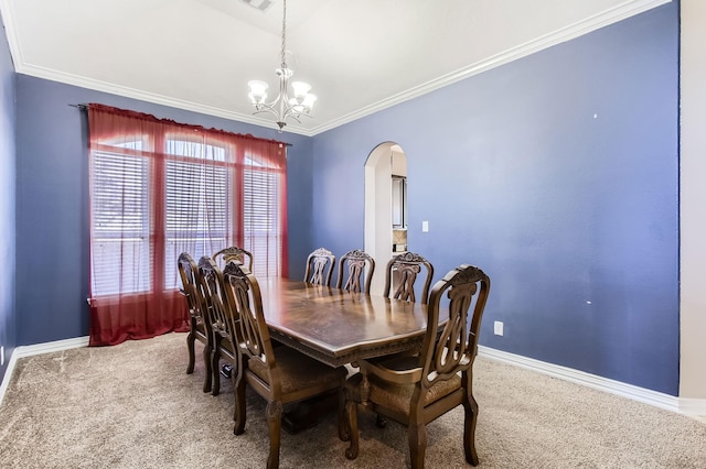 dining area with arched walkways, crown molding, an inviting chandelier, and carpet floors