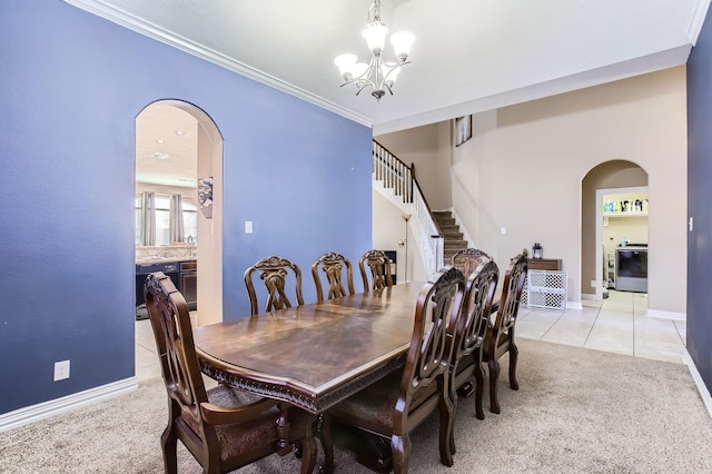 dining area featuring arched walkways, light carpet, and stairs