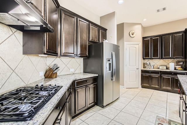 2730 Diamond Vista Ln, Rosharon, TX 77583 - kitchen featuring ventilation hood, black gas cooktop, stainless steel refrigerator with ice dispenser, light tile patterned flooring, and backsplash