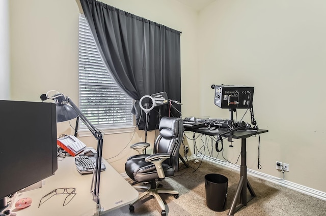 carpeted home office with baseboards