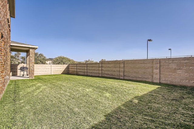 view of yard featuring a fenced backyard