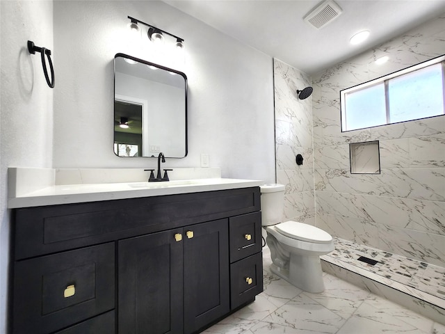 bathroom featuring visible vents, a shower stall, toilet, marble finish floor, and vanity