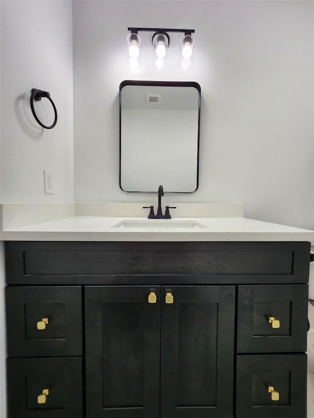 bathroom featuring visible vents and vanity