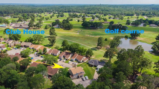 birds eye view of property with a residential view, view of golf course, and a water view