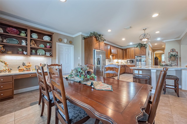 dining area with built in desk, recessed lighting, arched walkways, crown molding, and light tile patterned floors