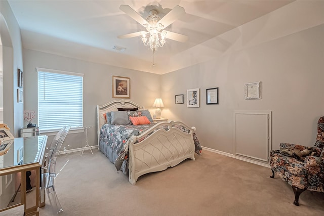 carpeted bedroom with visible vents, ceiling fan, and baseboards