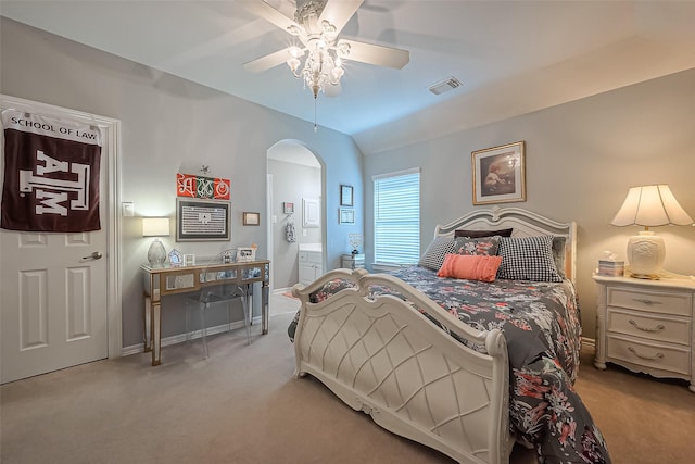 bedroom featuring vaulted ceiling, visible vents, arched walkways, and carpet floors