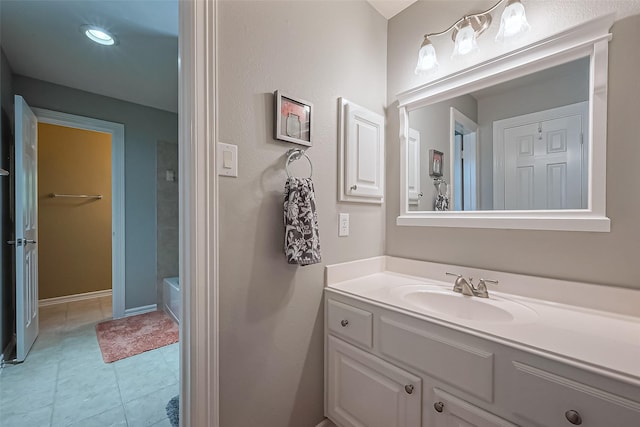 full bathroom with baseboards, vanity, and tile patterned flooring