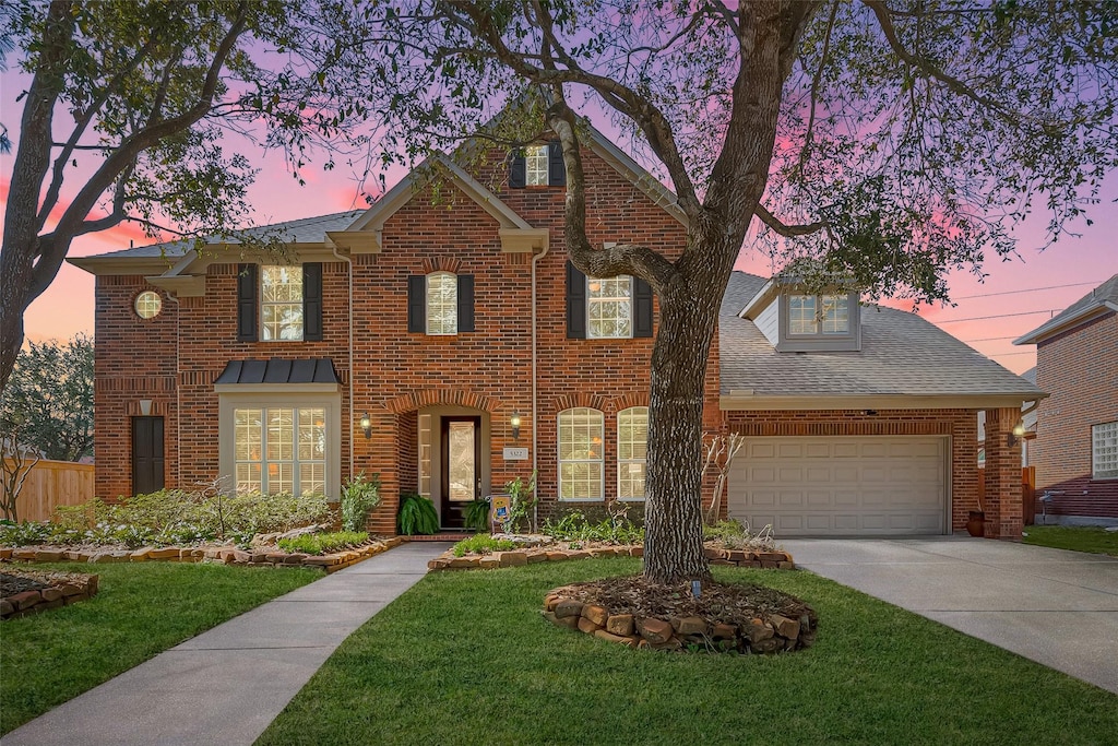 5322 Arcadia Glen Ln, Katy, TX 77494 - view of front of home with a lawn, roof with shingles, concrete driveway, a garage, and brick siding