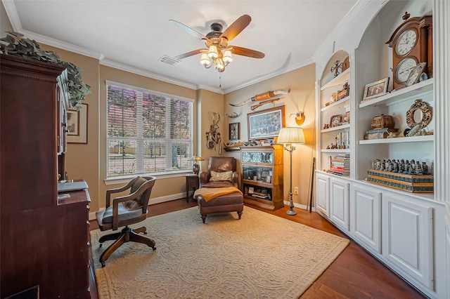 office area with ceiling fan, visible vents, ornamental molding, and dark wood-style flooring