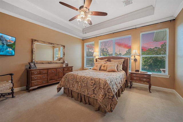 bedroom featuring a raised ceiling, light carpet, visible vents, and ornamental molding