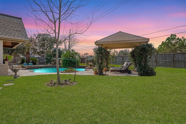 view of yard featuring a patio area, a fenced in pool, and a fenced backyard