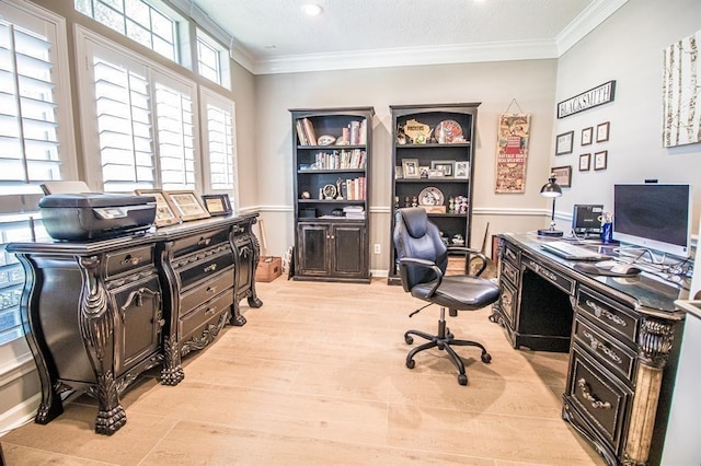 home office featuring light wood-type flooring and crown molding